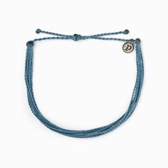 Dusty Blue Anklet by Pura Vida Pura Vida Original Anklet in the Color Dusty Blue Sandy feet look so much cuter when you’re wearing one of our Original Anklets. Designed to look like our best-selling Original bracelets, these are the everyday anklets you’ll be wearing by the pool and to the beach all summer long. Slightly larger than our original bracelets, your ankle can now be as stylish as your wrist! Every anklet is 100% waterproof. Go surf, snowboard, or even take a shower with them on. Wear Blue Anklet, Leather Anklets, Gold Waves, Pura Vida Bracelets, Ankle Chain, Star Chain, Hang Ten, Evil Eye Ring, Rainbow Earrings