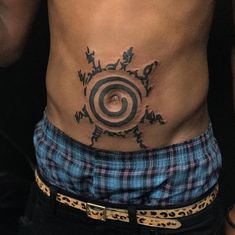 a man's stomach with a tattoo on it