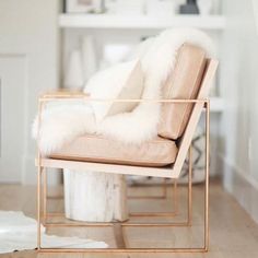 a chair with fur on it in a living room