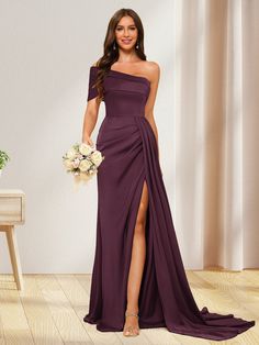 a woman in a long purple dress holding a bouquet and posing for the camera with her legs slited