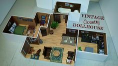 an overhead view of a dollhouse with furniture and accessories in the floorplan