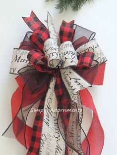 a red and black bow with words on it