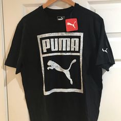 New With Tags Casual Black Tops With Puma Logo, Casual Black Top With Puma Logo, Black Sporty Top With Puma Logo, Sporty Black Top With Puma Logo, Sporty Black T-shirt With Puma Logo, Black Sporty T-shirt With Puma Logo, Puma Tshirts, Black Puma Graphic Tee, Crew Neck Cotton T-shirt With Puma Logo