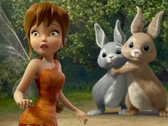 a woman standing next to three rabbits in front of trees