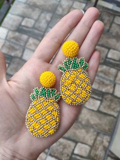 "Beaded pineapple fruit earrings Yellow embroidered tropical citrus jewelry Chunky big Statement summer bright funny drop dangle beadwork ♡I promise that you will always be in the spotlight with such earrings!♡ Size: length - 6 cm (2.4 inches) width - 3 cm (1.2 inches) ❤ CUSTOM ORDERS It is ABSOLUTELY HANDMADE . So if you like this item in a different color or size, send me a message please. I will send you a link for a \"custom order\" and you'll be able to place the order there. Please feel fr Summer Beach Jewelry With Fruit Design, Cute Beaded Earrings For Summer, Fun Beaded Earrings For Summer, Fun Beaded Earrings For Summer Gifts, Yellow Beaded Drop Earrings For Summer, Handmade Yellow Jewelry For Summer, Summer Orange Jewelry With Fruit Design, Tropical Green Jewelry For Summer, Tropical Green Summer Jewelry