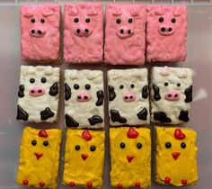 decorated cookies are arranged in the shape of cows and farm animals with faces on them