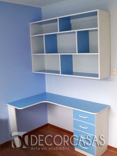 a blue and white desk in an empty room