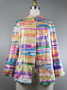 "This is a RARE and GORGEOUS vintage piece! It's fully embellished with colorful iridescent pastel sequins and accented with an embroidered bird on the back. It's in absolutely perfect condition! Bust - 40\" (with the one closure intact) Shoulders - 17\" hem to hem Sleeves - 20\" Length - 24\" Tag Size - US 10 All of my items come from a smoke-free and pet-free home. If you have any questions, please don't hesitate to ask!" Spring Multicolor Sequin Fabric, Iridescent Sequin Fabric For Spring, Glamorous Multicolor Sequin Fabric For Spring, Spring Embellished Multicolor Sequin Fabric, Embellished Multicolor Outerwear For Spring, Multicolor Embellished Outerwear For Spring, Sequin Kimono, Iridescent Sequin, Checkered Jacket