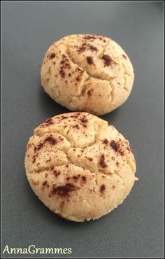 two round breads sitting on top of a table