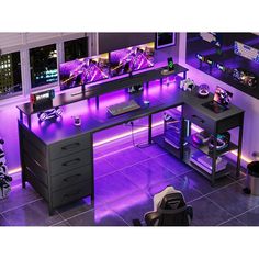 a computer desk with two monitors on top of it and purple lighting in the room