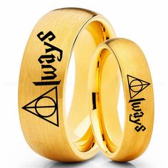 two gold wedding rings with the words harry potter and deathly hall written on them