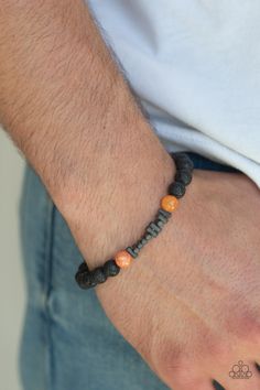 An earthy collection of metallic accents, glassy orange stones, and black lava beads are threaded along a stretchy band around the wrist for a seasonal look. Sold as one individual bracelet. P9SE-UROG-031XX Lava Rock Bracelet, Lava Bead Bracelet, Orange Bracelet, Lava Bracelet, Orange Stone, Lava Beads, Ball Necklace, Band Bracelet, Paparazzi Accessories