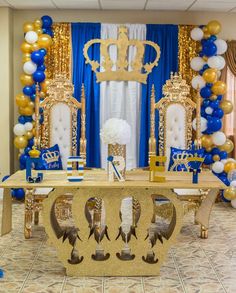 a table with chairs and balloons in the background