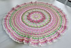 a crocheted doily is sitting on a table