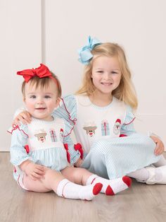 Get festive and coordinate with this sibling set! This girls' ruffle dress features light blue pin stripes, red trim, and bow accents. Plus, the embroidered holiday motif adds a playful touch. Complete your family's holiday wardrobe with this adorable dress. Fits true to size. 95% Polyester / 5% Spandex Combo: 97% Cotton / 3% Spandex Accessories sold separately. Suggest 5 inch bow color: #1 & #51 Import. Stella is 42 inches tall and 35 lbs wearing size M (3 YRS). *Afterpay and Sezzle Purchase Re Kid Pictures, Girls Ruffle Dress, Xxxl Dress, Blue Pin, Season's Greetings, Holiday Wardrobe, Feature Light, Family Holiday, Kids Pictures