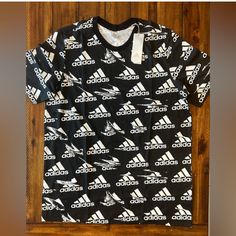 Mens Size Xlt New With Tags Sporty Black Printed T-shirt, Casual Black Printed T-shirt, Adidas Graphic Tee With Logo Print, Black Sporty Printed T-shirt, Adidas Short Sleeve T-shirt With Graphic Print, Adidas Graphic Print Short Sleeve T-shirt, Sporty Printed Cotton T-shirt, Black Printed Sporty Top, Black Printed Cotton T-shirt