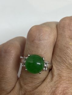 Vintage green nephrite jade Ornate German Silver ring, does not tarnish, NOT sterling Sizes 7, 8 or 9 All rings are shipped in a nice gift box. Check out our over a THOUSAND great reviews Engraving is $4 per letter and is not always perfect depending on the piece. It can take a few days if the jeweler is busy. This is payable to Paypal Judithsltd@gmail.com Collectible Round Emerald Ring, Green Jade Round Stone Jewelry, Green Jade Jewelry With Round Stone, Green Emerald Crystal Ring, Vintage Round Jade Rings, Classic Green Jade Jewelry, Round Jade Collectible Jewelry, Collectible Round Jade Jewelry, Jade Gemstone Ring With Round Stone