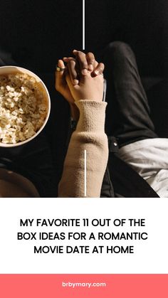 someone holding their hand over a bowl of popcorn