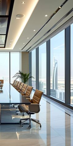 an empty conference room with chairs and a large table in front of glass windows overlooking the city