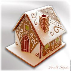 a gingerbread house is decorated with icing