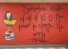 there is a sign on the wall that says, somewhere inside of all of us is the power to change the world matilda