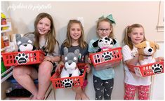 four girls are holding stuffed animals in baskets