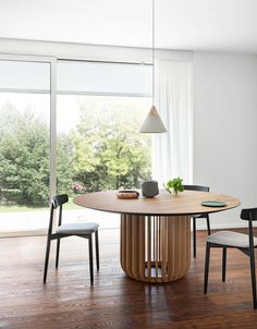 a dining room table with chairs around it