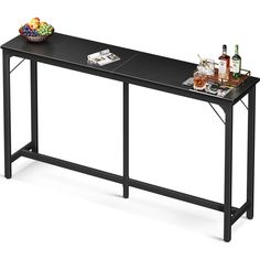 a black table with two trays on it and bottles of wine next to it