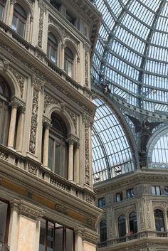 the inside of a building with many windows and arches on it's sides,