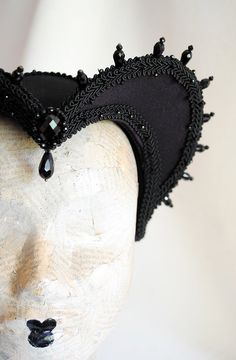 This is a purple and black version of one of most successful designs called Countess. This vampire style headdress is covered with dark purple taffeta and embellished with black cord trimming all around the edges.It is further trimmed with black crystal details that create a halo effect as well as small l beads that were hand-sewn on the trimming to create rich textural interest. The piece is completed with a black crystal handmade element placed at the center front for all that extra drama that Queen Headpiece, Gothic Headdress, Vampire Style, Purple Gothic, Festival Headpiece, Halo Effect, Vampire Queen, Mini Top Hat, Halloween Vampire