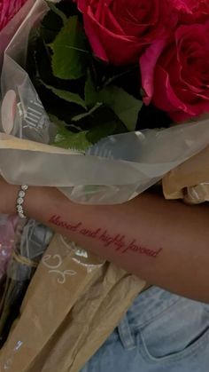 a woman holding a bouquet of roses with the words i love you written on it