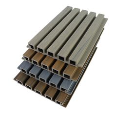 several different types of wood planks stacked on top of each other in various sizes and colors