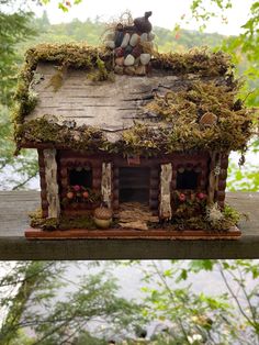 two pictures of a small house with moss growing on the roof and in the back