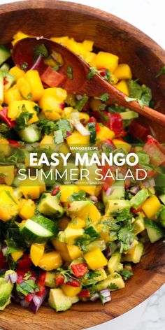 an easy mango summer salad in a wooden bowl