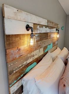 a wooden headboard with two lights on it