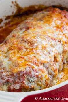 a casserole dish with meat covered in cheese and marinara sauce, ready to be eaten