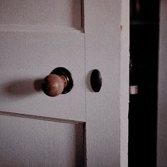 an open door with two knobs on it