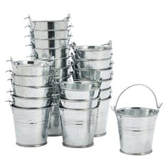 a bunch of metal buckets stacked on top of each other