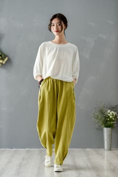 Get ready for the summer season with our Vintage Summer Ginger Washed Linen Casual Women's Tapered Pants. Crafted by The Best Tailor, these pants are a must-have for your casual wardrobe. Main Features: Lightweight and breathable linen fabric Flattering tapered fit for a sleek silhouette Adjustable waist size (66-96cm / 25 - 37') and hips (112cm / 44') Comfortable pants length of 96cm / 37' These pants are versatile and can be styled for any casual occasion, whether it's a day at the beach or a Olive Wide Leg Pants For Spring, Green Wide Leg Pants With Elastic Waistband, Green Wide-leg Loungewear Pants, Green Harem Pants With Pockets For Loungewear, Olive High-waisted Pants For Spring, Green Relaxed Fit Wide-leg Pants, Casual Green Wide Leg Pants For Spring, Baggy Green Wide Leg Pants With Elastic Waistband, Spring Green Harem Pants With Elastic Waistband