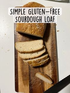 sliced loaf of bread sitting on top of a wooden cutting board