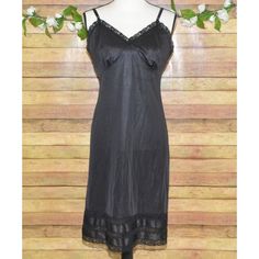 Classic vintage LADY MANHATTAN full slip dress in black. Silky nylon, size 36 M, snip-to-fit length, adorned with delicate lace trim. Ideal for any woman who appreciates timeless style. * Vintage LADY MANHATTAN slip dress * Black, silky nylon material * Size 36 M * Snip-to-fit length (3 Length Options Just Cut Off What You Don't Need)   * Delicate lace trim Location: Section 2 Please SEE measurements of the clothing items to insure fit! Measurements are in the last photo. To check measurements, Black Fitted Lined Slip Dress, Fitted Black Lined Slip Dress, Fitted Black Slip Dress With Lace Trim, Black Lined Slip Dress For Night Out, Fitted Black Knee-length Slip Dress, Black Sheer Slip Dress, Fitted Knee-length Black Slip Dress, Slip Dress Black, Vintage Lady