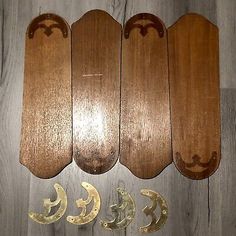 five wooden boards with metal handles on them