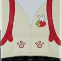 a white sweater with red trim and bunny ears on it