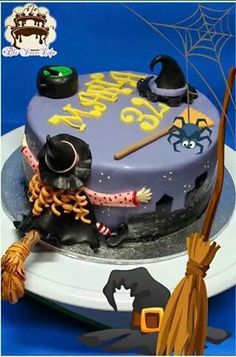 a birthday cake decorated to look like a witch