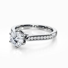 a white gold engagement ring with diamonds on it