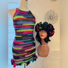 a mannequin is next to a crocheted dress