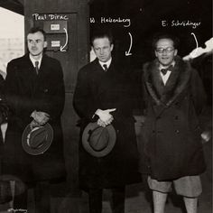 an old black and white photo shows three men in suits with hats standing next to each other