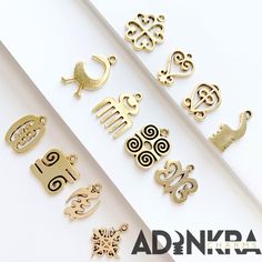 "NOW INCLUDES AKOBEN** These Antique Gold Adinkra Charms are perfect for personalizing a bracelet or necklace or they are light enough for earrings! Every charm is made right here in the United States, free of nickel, lead and cadmium. This set includes- 2 of the following charms - Sankofa - Sankofa Bird - Dwennimmen - Gye Nyame - Odo Nnyew Fie Kwan - Funtunfunefu-Denkyemfunefu - Duafe - Hye Won Hye - Nyame Dua - ESE NE TEKREMA - KWATAKYE ATIKO - AKOBEN Size: 3/4\" x 3/4\"" Handmade Gold Symbolic Charms, Handmade Symbolic Gold Charms, Symbolic Handmade Gold Charms, Handmade Gold Charms For Crafting, Afro Jewelry, Gye Nyame, African Tattoo, African Symbols, Adinkra Symbols