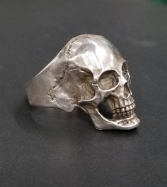 Handmade at FREEDOM RINGS in Fort Smith, AR. Anatomically correct silver Skull Ring. Classic Polished Skull Ring Collectible, Classic Skull Ring As Gift With Polished Finish, Silver Skull Ring With Polished Finish For Formal Occasions, Formal Silver Skull Ring With Polished Finish, Classic Hand Cast Sterling Silver Rings, Classic Sterling Silver Hand Cast Rings, Classic White Gold Skull Ring In Sterling Silver, White Gold Sterling Silver Skull Ring, Classic White Gold Sterling Silver Skull Ring