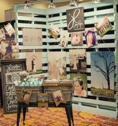 a table with pictures on it in front of a wall